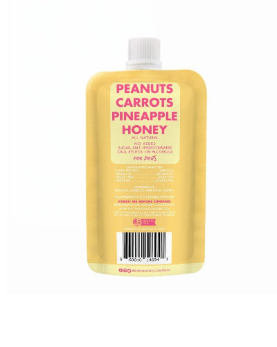 Yellow bottle with a label featuring 'Peanuts Carrots Pineapple Honey' on a white background