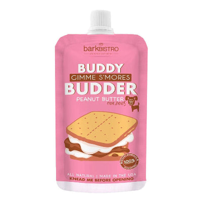 Pink pouch of 'Buddy Gimme S'mores Budder' peanut butter for dogs by barkbistro on a white background