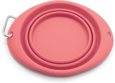 Pink silicone pet travel bowl with a carrying handle on a white background