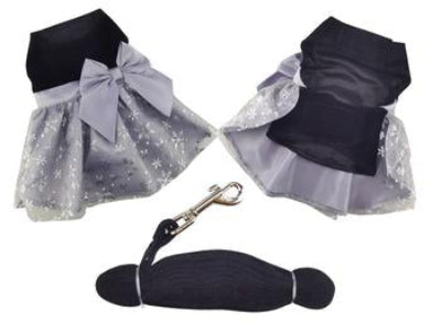 Black pet dress with silver glitter and a matching leash on a white background