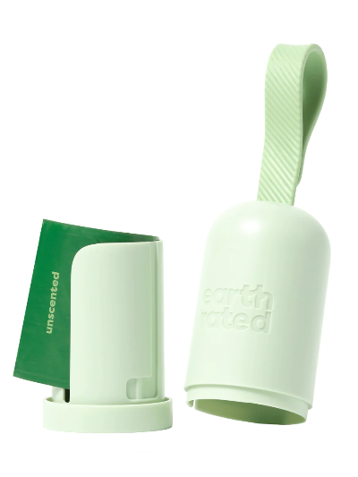 Green silicone pet waste bag holder with 'unscented' label on a white background