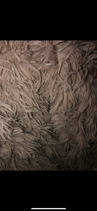 Close-up of a light brown fluffy blanket