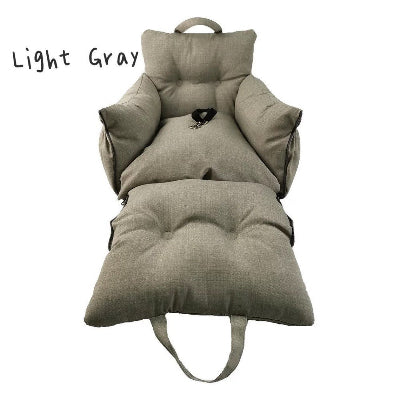 Light gray cushion with handles on a white background
