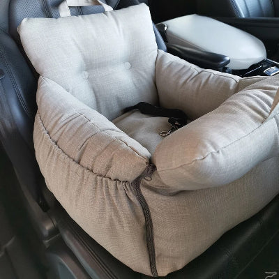 Beige pet car seat in a vehicle interior