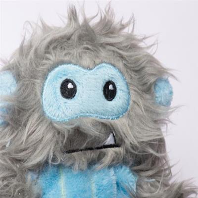 Plush toy resembling a creature with gray fur and blue accents on a white background