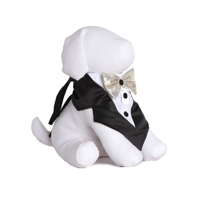 White dog mannequin wearing a tuxedo bandana with a bow tie on a white background