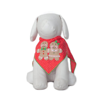 White dog mannequin with a red polka dot bandana featuring gingerbread men on a white background