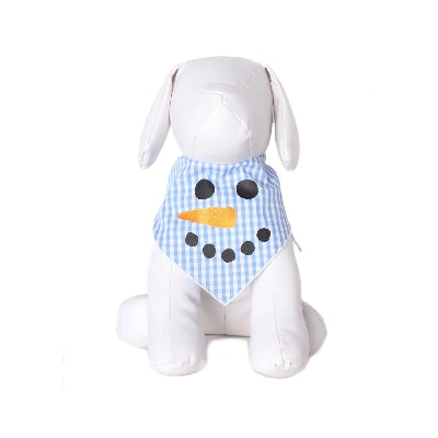 White dog wearing a blue checkered snowman-themed bandana on a white background
