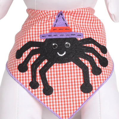 Orange checkered pet bandana with a spider design on a white background