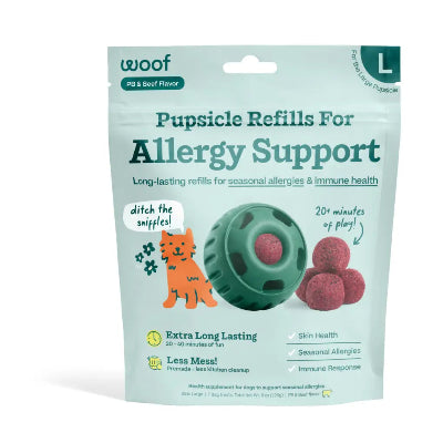 Package of 'woof' puppysicle refills for allergy support with a green ball and red balls on a light blue background.