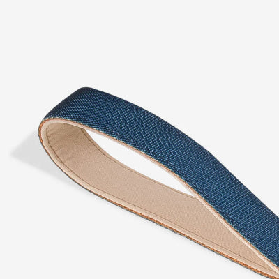 Close-up of a blue leash handle on a white background
