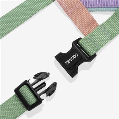 Green dog harness with black clip and 'Zeedog' branding on a white background
