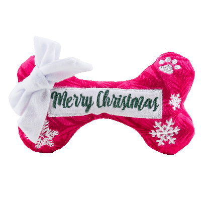 Pink bone-shaped Christmas toy with 'Merry Christmas' text and snowflake designs on a white background