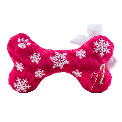 Pink bone-shaped toy with snowflake patterns on a white background