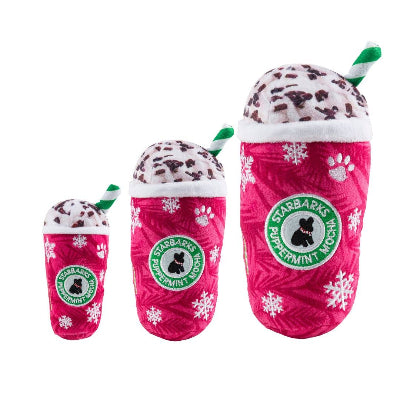 Set of three pink dog toys shaped like Starbucks drinks with paw prints and a logo on a white background.