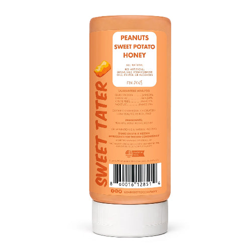 Orange squeeze bottle of Bark Bistro Sweet Tater Buddy Budder Peanut Butter for dogs with ingredients and guaranteed analysis on white background.