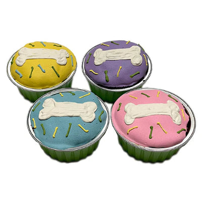 Four colorful dog cupcakes with bone designs on a white background