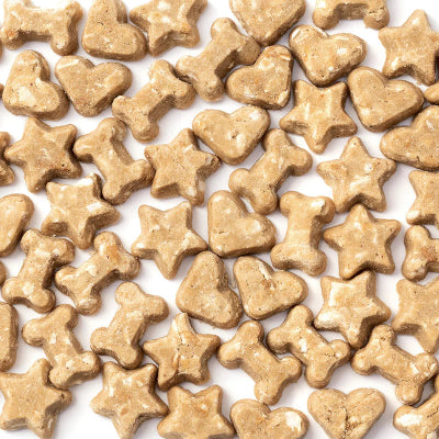 Dog treats shaped like stars and hearts on a white background