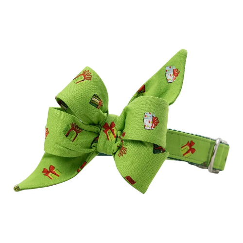 Green dog collar and bow featuring Christmas gifts on white background.