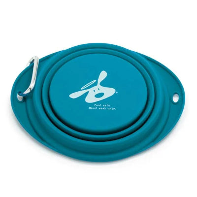 Teal silicone dog travel bowl with a carabiner on a white background