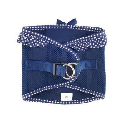 Navy blue dog harness with white polka dot trim on a white background