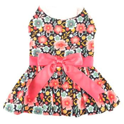 Floral dog dress with a large pink bow on a white background