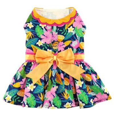 Colorful floral dog dress with a large yellow bow on a white background
