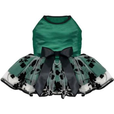 Green pet dress with black floral pattern and large bow on a white background