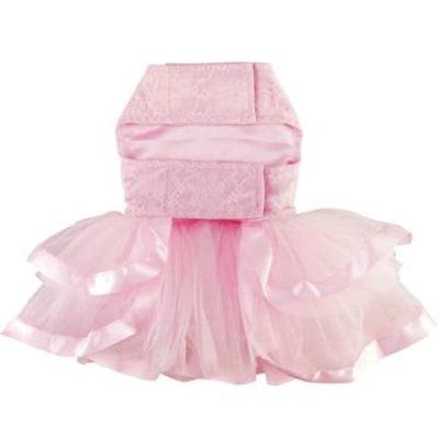 Pink pet dress with a bow on a white background