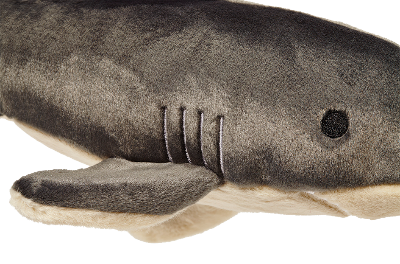 Close-up of a plush shark dog toy on a white background