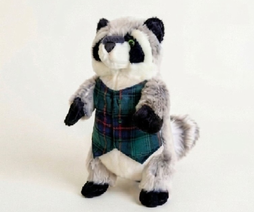 Raccoon dog toy wearing a green & blue plaid vest on white background.