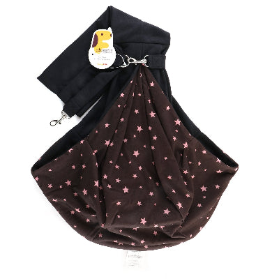 A pet carrier pouch in dark brown with a pink star pattern, attached to a black shoulder strap with a metal clip and a hanging product tag.
