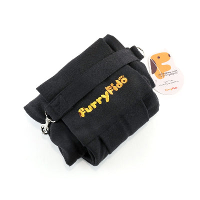 A black pet sling with 'FurryFido' embroidered in yellow on the front, shown with its product tag on a white background.