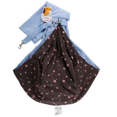 A pet sling carrier bag with a light blue fabric exterior and a dark brown interior printed with pink stars, shown on a white background with its attached hangtag.