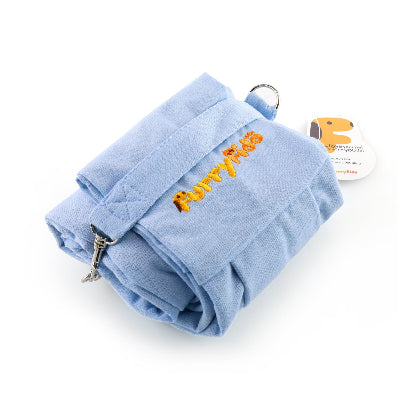 A light blue fabric pet sling rolled up, featuring 'Furry Fido' embroidered in orange on the strap, with a metal clasp and a small product tag attached.