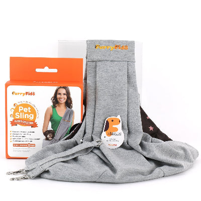 Gray pet sling carrier shown partially unfolded with its orange retail box behind it on a white studio background. The package shows the FurryFido brand and a photo of a woman wearing the carrier.