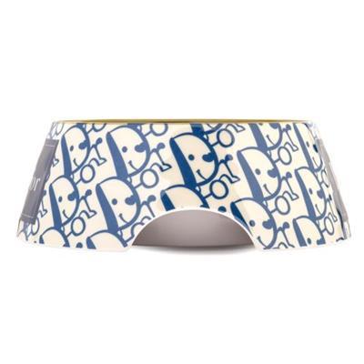 Pet bowl with blue and white pattern on a white background