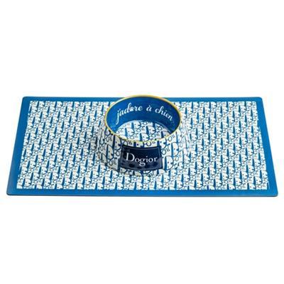 Blue and white patterned mat with a small bowl on a white background