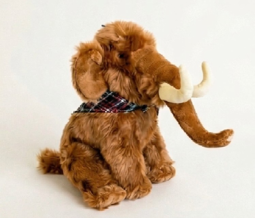 Brown Woolly Mammoth dog toy wearing plaid scarf on white background.