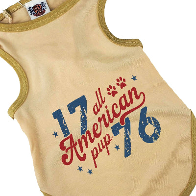 Beige tank top with '17 all American pup 76' text and paw prints on a white background