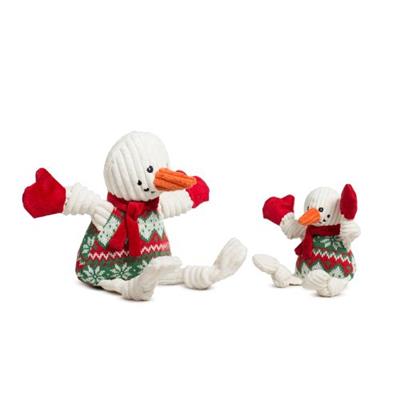 Two snowman dog toys with red scarves and green hats on a white background