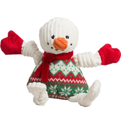 Plush snowman dog toy with a red scarf, white gloves, and green knitted sweater on a white background