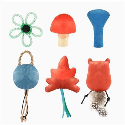 Set of colorful cat toys including a flower, mushroom, leaf, and owl on a white background