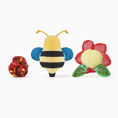 Toy bee and flowers on a white background