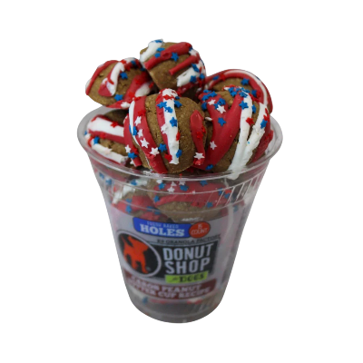 Donuts with red, white, and blue icing in a cup labeled 'Donut Shop'.