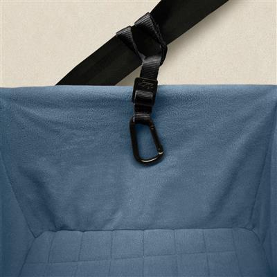 Blue bag with a black strap and carabiner on a beige background