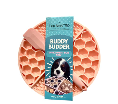 Pink honeycomb enrichment mat with 'barkBISTRO Buddy Budder' packaging on a white background