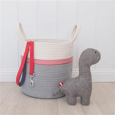 Gray Dinosaur Dog Toy sitting beside rope toy basket