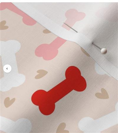 Fabric with red bone design and pink hearts on a beige background
