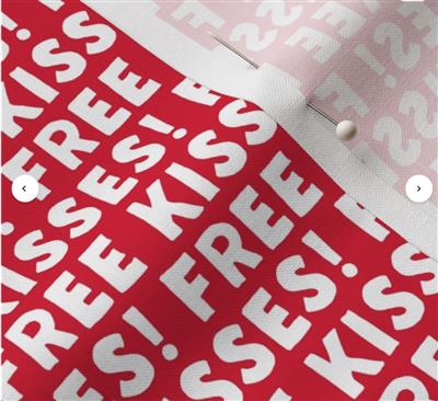 Red and white paper with 'FREE KISSES!' text on a white background